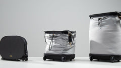 Olla Bag shown in three configurations: compact handbag, medium trolley, and large trolley, highlighting its convertible design