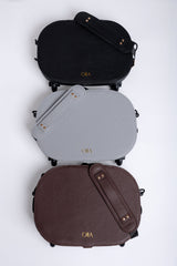 Three bags in black, gray, and brown stacked on a white background with 'Olla' branding.